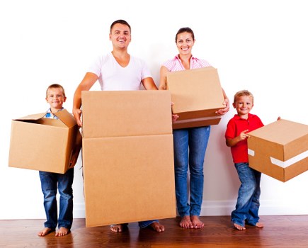 Removal van and moving team in a residential Leyton street