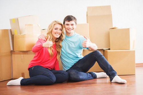 Packed moving boxes and furniture ready for transport by a Leyton removals company