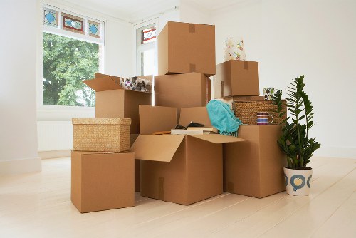 Boxes and household items being arranged inside a moving van