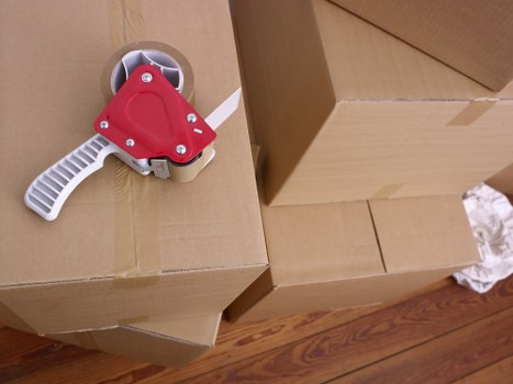 Professional movers loading household items for a local Leyton relocation
